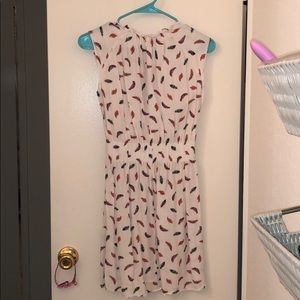 Cinched white dress with feathers